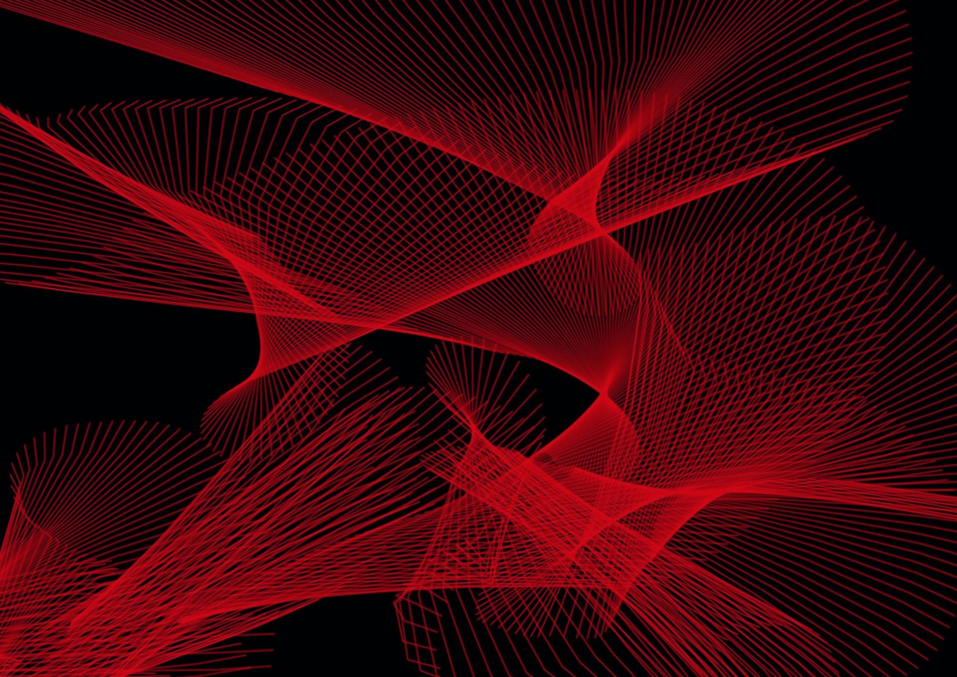Abstract red lines crossing and curving on a black background.